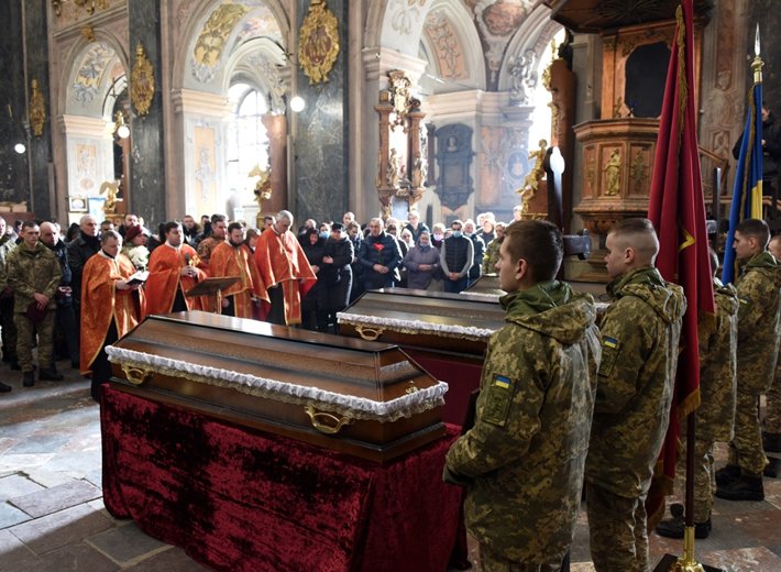 Memorial service March 9, 2022 for Ukrainian servicemen during Russia's invasion of Ukraine, at the Saints Peter and Paul Garrison Church in Lviv. (Photo by Shutterstock.com)