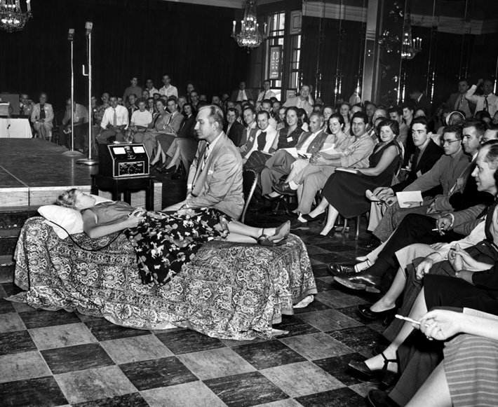 L. Ron Hubbard demonstrating his discoveries on the mind, spirit and life to students in 1952