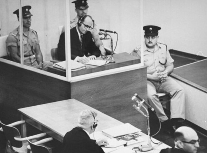 Adolf Eichman inside his glass booth during the Eichmann Trial in Jerusalem in 1961. (Photo Ccourtesy of Israel Government Press Office, Public Domain)